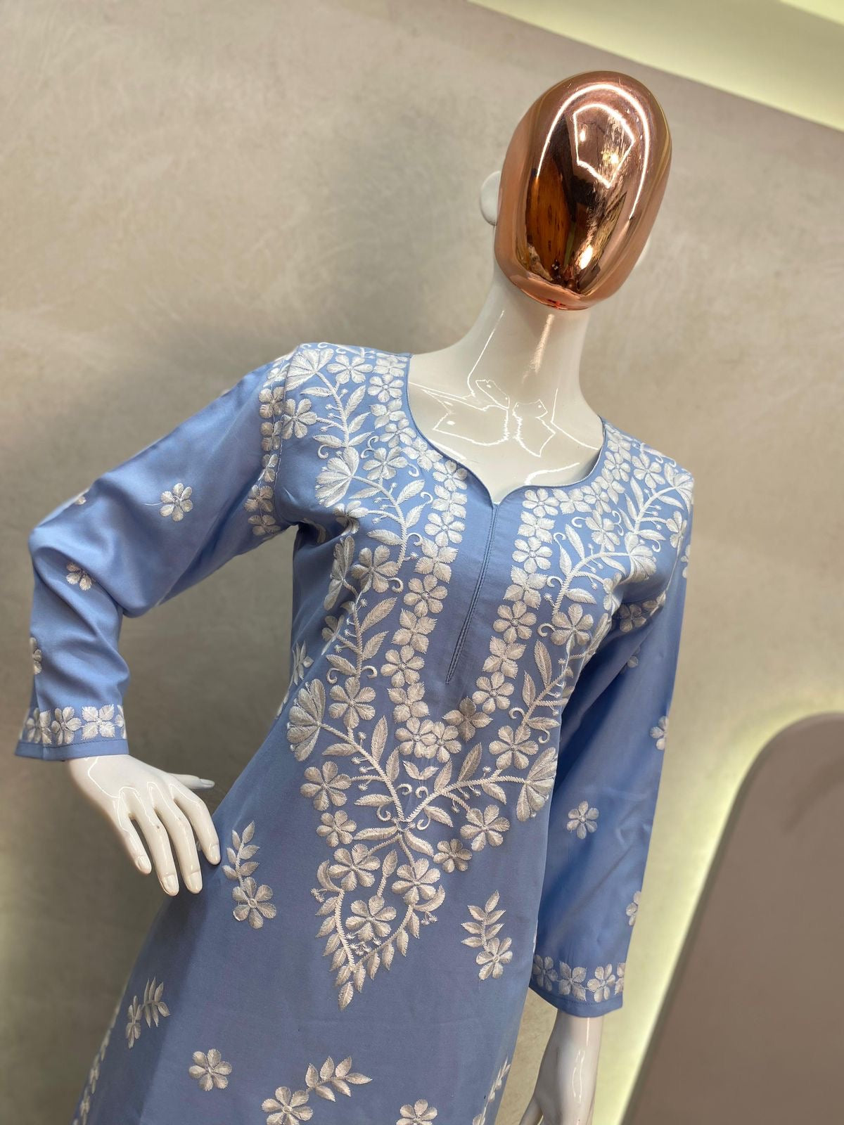 Stylish Muslin Kurti paired with a beautifully embroidered Sharara